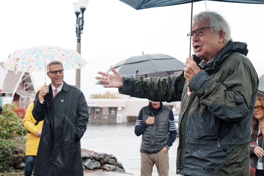 Brian Griffin, right, speaks to a crowd during the unveiling of a street sign near the Fairhaven Library on Monday, Oct. 16. The street off Finnegan Way was named Brian Griffin Lane after the local historian, to honor his lifetime of dedication to the Bellingham community.