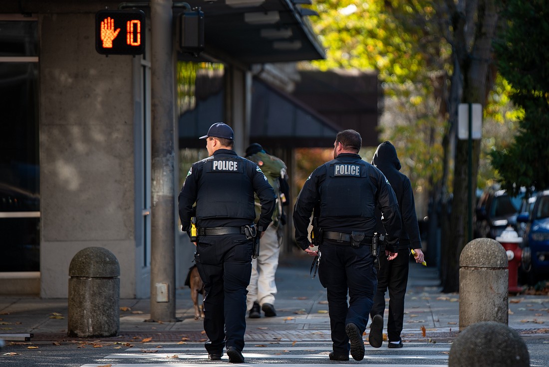 A pair of police officers patrol downtown Bellingham Oct. 25. The Bellingham Police Department resumed officer foot patrols downtown in July on an overtime basis.