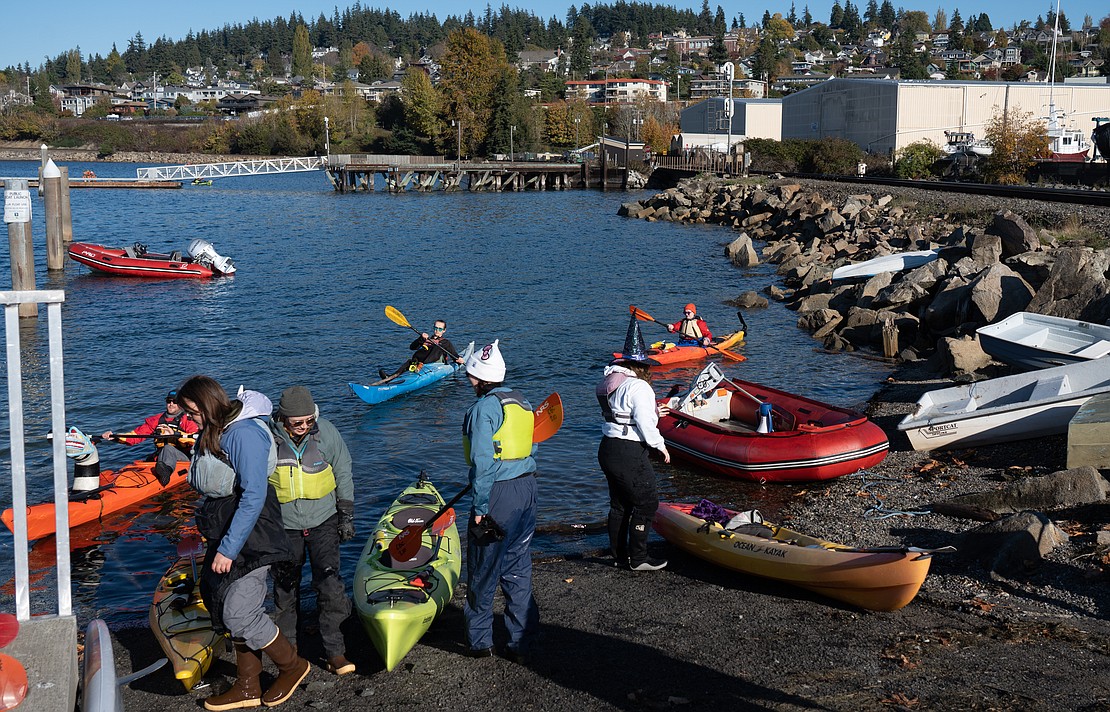 Attendees pull their vessels out of the water after the parade.