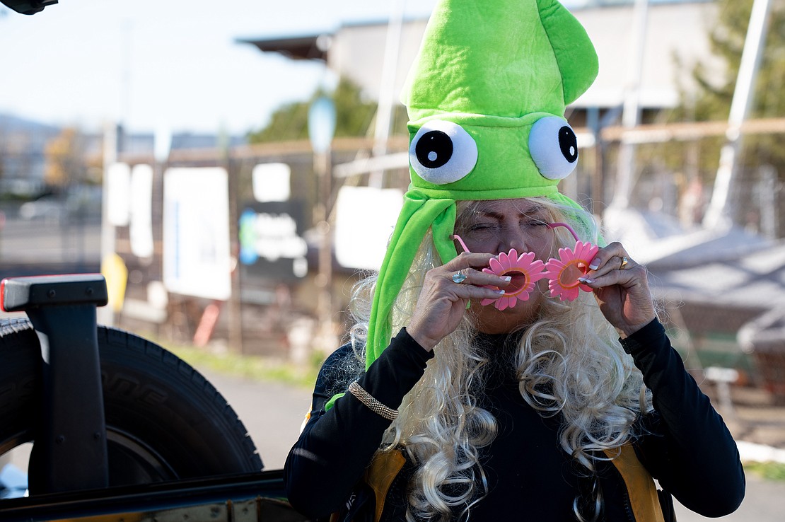 Mickey Middendorf, 58, put her costume on near the back of her Jeep Wrangler at the Community Boating Center.