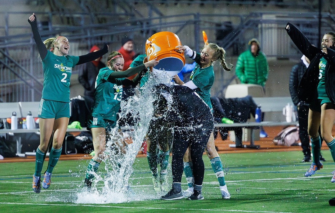 Sehome players dowse head coach Emily Webster with water after the Mariners beat Cedarcrest 4-1 Tuesday, Oct. 31 at Civic Stadium, securing a state berth.