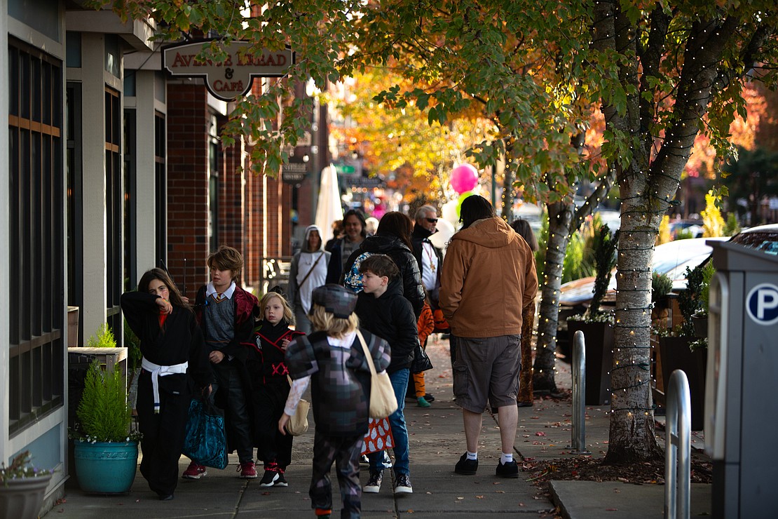 Trick-or-treaters roam the streets of Fairhaven.