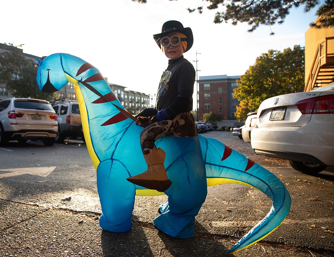 Bobby McDonald, dressed as a Minion cowboy, "rode" through Fairhaven on a Diplodocus dinosaur.