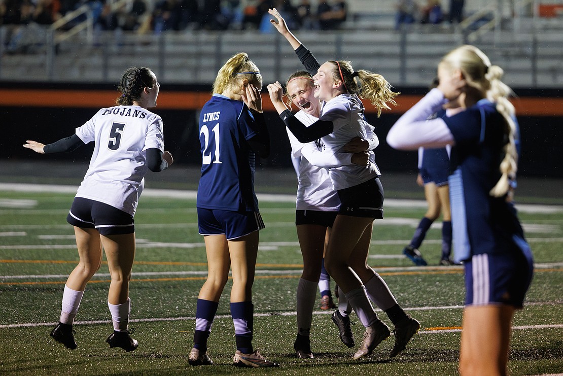 Meridian’s Morgan Adams raises her hands in celebration after scoring a goal Wednesday, Nov. 1 as the Trojans shut out Lynden Christian 3-0 in the 1A District 1 championship game at Blaine High School.