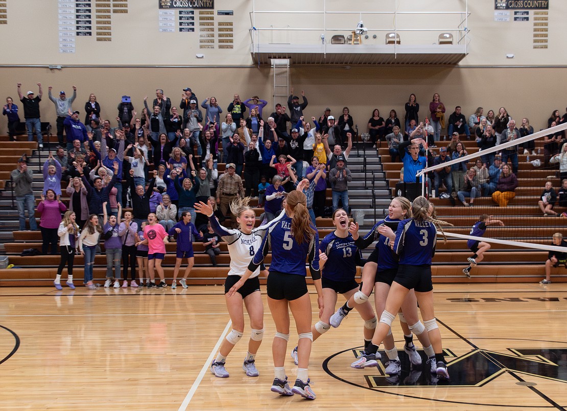 Nooksack Valley celebrates the point that punched the team's ticket to state Thursday, Nov. 2. The Pioneers beat Lynden Christian 3-1 in the loser-out, winner-to-state match.