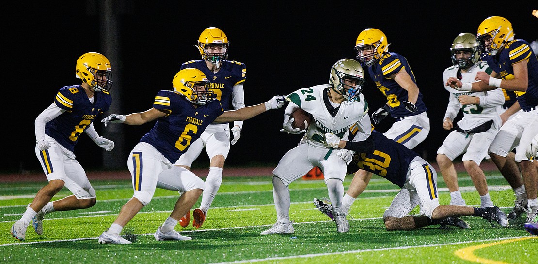 Timberline running back Ronaldo Salazar-Gonzalez is stopped by Ferndale’s Ryder Beaven (30) and Kleaveland Atwood (6).