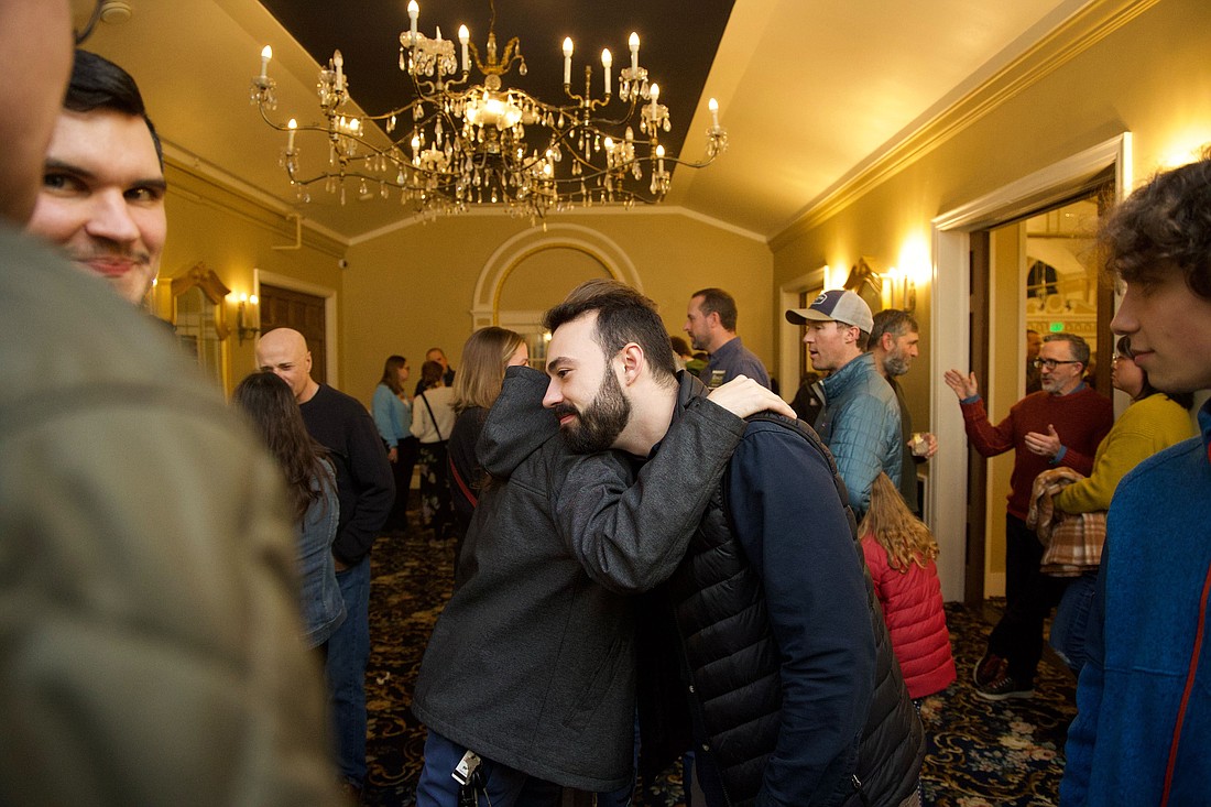 Bellingham City Council at-large candidate Jace Cotton hugs Joel Pitts-Jordan after hearing preliminary election results Tuesday, Nov. 7 at Hotel Leo in Bellingham. Cotton leads his race with 52.75% of the votes as of Wednesday, Nov. 8.