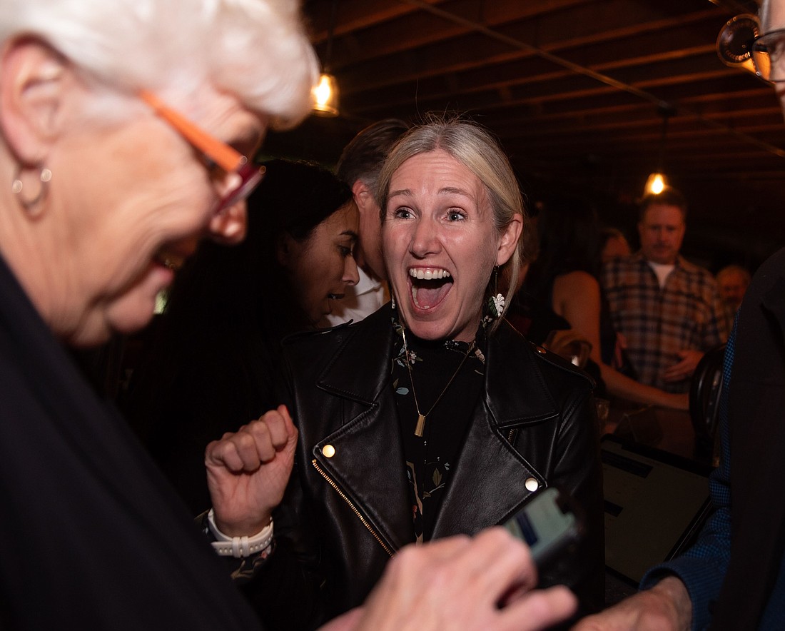 Bellingham mayoral candidate Kim Lund reacts after hearing results from the first round of counted ballots Tuesday, Nov. 7 at an election night party at Penny Farthing in Bellingham. Lund, with 52.4% of the votes, leads the race against Seth Fleetwood, who received 47.1%, as of Wednesday, Nov. 8.