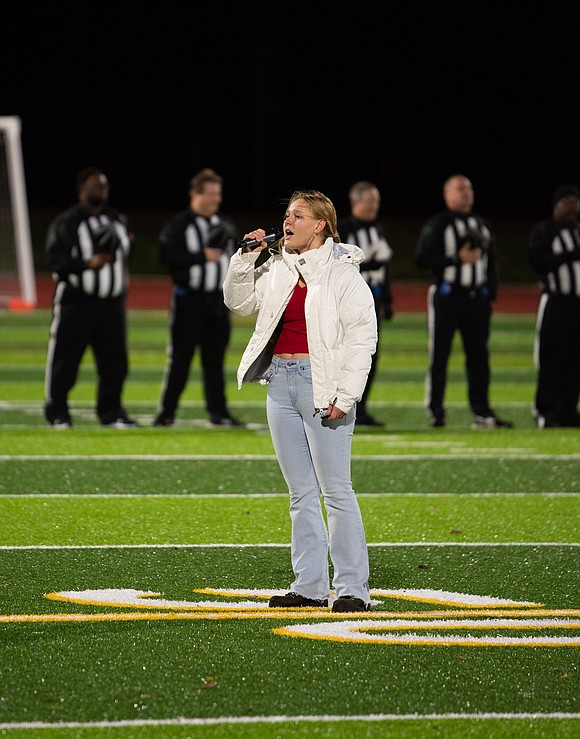 Ferndale sophomore Cecelia Carlson sings the national anthem.