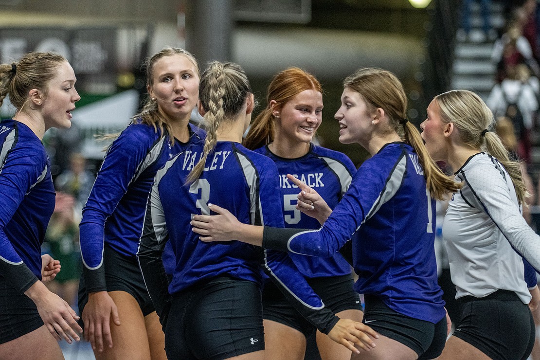 Nooksack Valley celebrates after winning the second set over King's Way Christian.