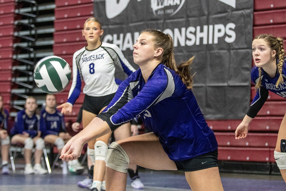 Nooksack Valley's Grace DeHoog works in serve-receive against Meridian.