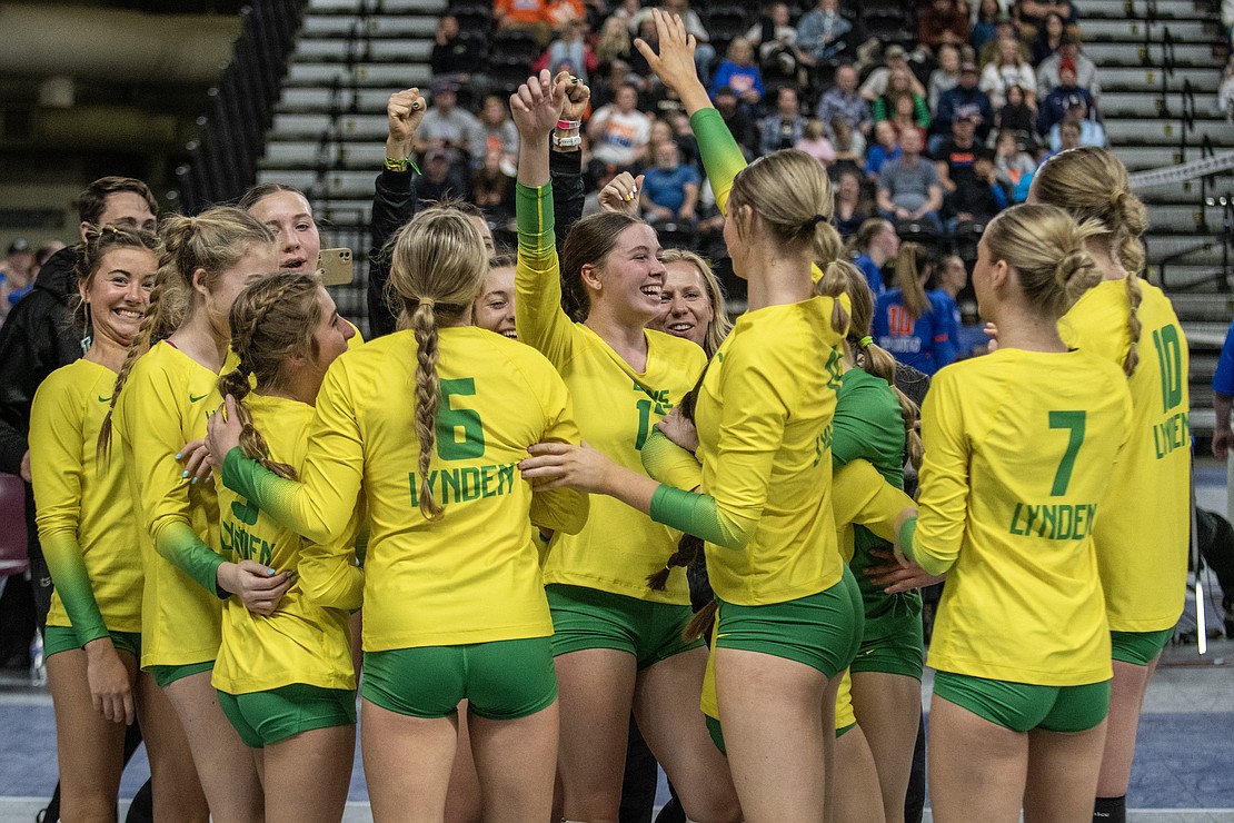 Lynden celebrates after sweeping Tumwater in the 2A state quarterfinals Friday, Nov. 10 at the Yakima Valley SunDome. The Lions clinched at least a top-four trophy with the win.