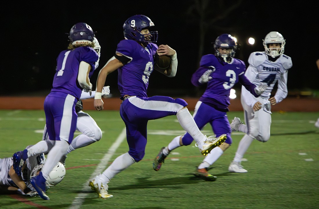 Nooksack Valley's Colton Lentz heads for a touchdown Saturday, Nov. 11 against Cascade Christian at Civic Field. Lentz scored four touchdowns in their 59-7 win, advancing the team to the next round of playoffs.