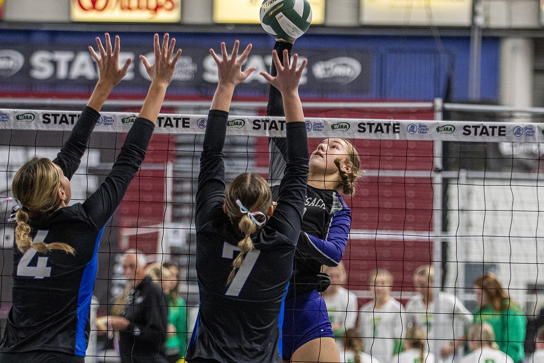Nooksack Valley's Elizabeth De Lange leaps for a spike Saturday, Nov. 11, in a 1A state quarterfinal matchup against Lakeside of Nine Mile Falls.