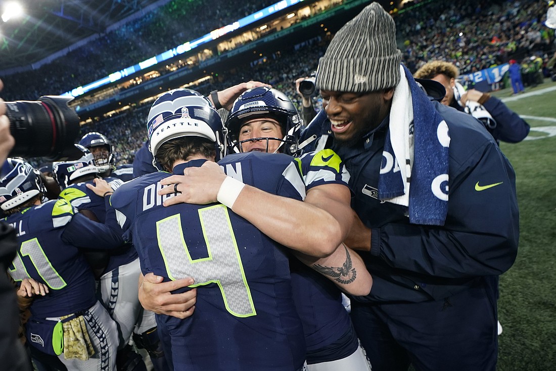 Seattle Seahawks place-kicker Jason Myers (5) celebrates with punter Michael Dickson (4) after kicking the winning field goal Sunday, Nov. 12 in Seattle.