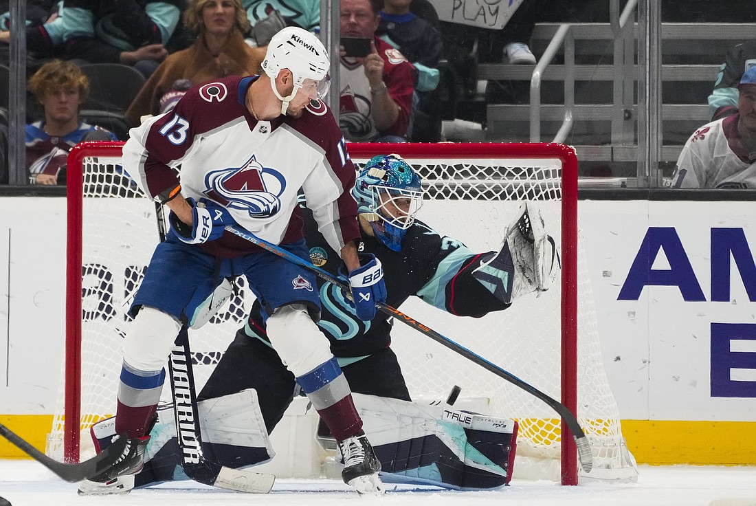 Colorado Avalanche right wing Valeri Nichushkin (13) redirects the puck for a backhanded goal against Seattle Kraken goaltender Joey Daccord during the third period of an NHL hockey game, Monday, Nov. 13, 2023, in Seattle. The Avalanche won 5-1.