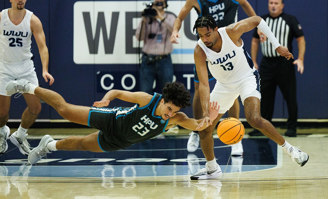 Western's Jonathan Ned gets a steal as Hawaii Pacific's Josh Nuisulu dives for the ball.