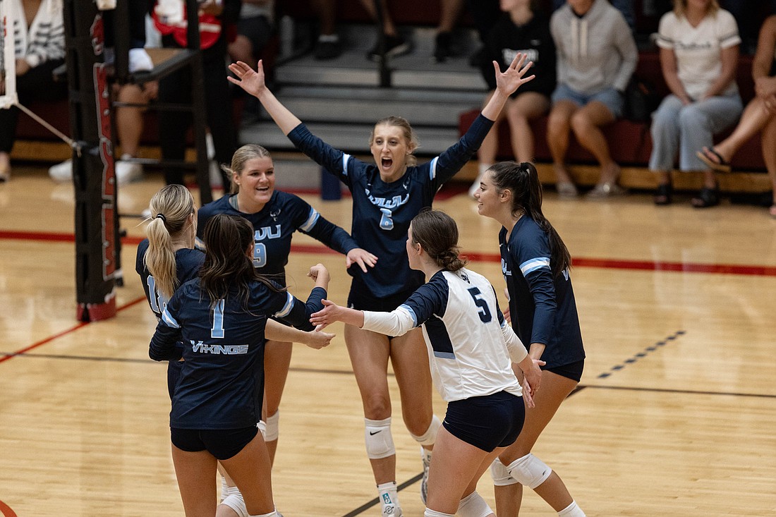 Western Washington volleyball celebrates Sept. 14 after scoring during a match at Central Washington University. The Vikings will host the Wildcats for their regular-season finale on Saturday, Nov. 18.