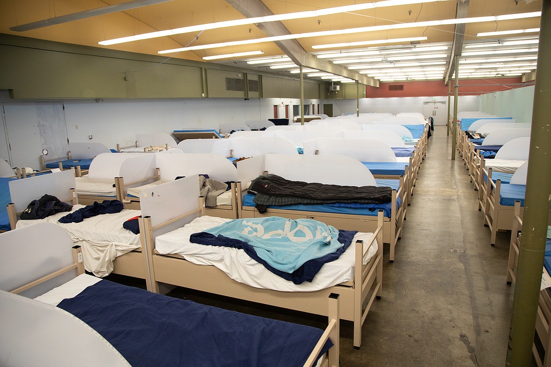 Beds fill the men's dorm of the Base Camp shelter run by Lighthouse Mission Ministries in Bellingham on Wednesday, Nov. 1.