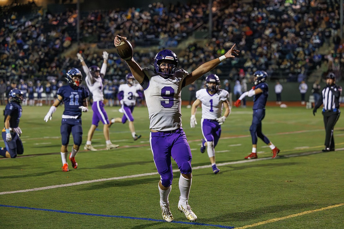 Nooksack Valley’s Colton Lentz celebrates a touchdown Friday, Nov. 17, as the Pioneers beat Lynden Christian, 47-14, in the 1A state quarterfinals at Civic Field. The Pioneers will face Lakeside of Nine Mile Falls in the semifinals.