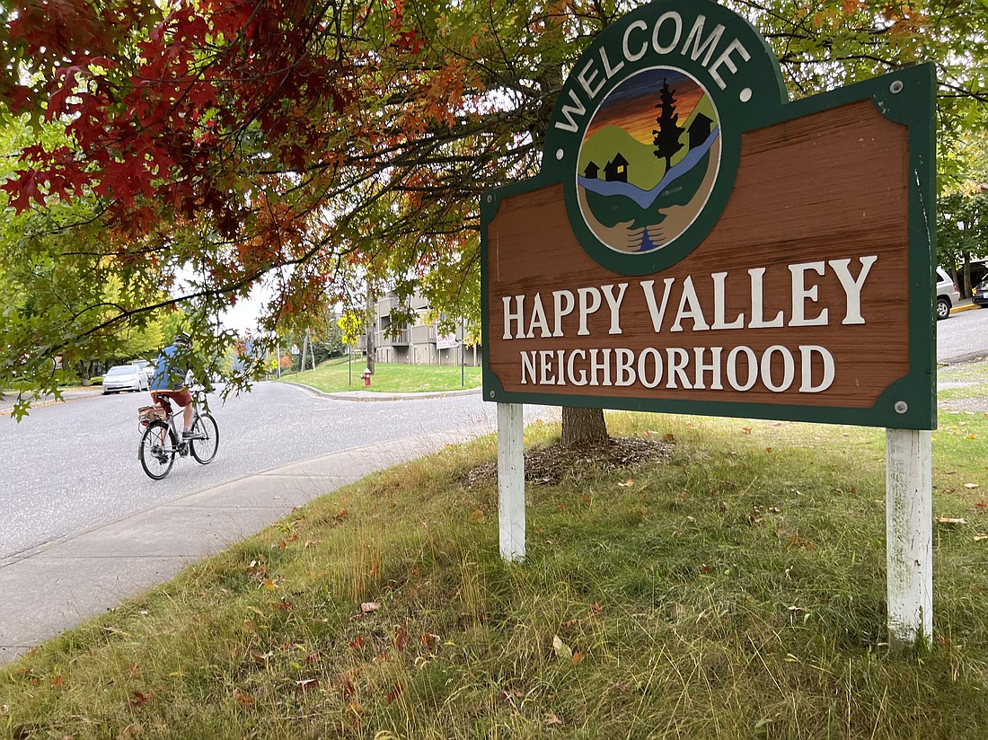 A Happy Valley neigbhboorhood sign welcomes travelers on 21st Street, just south of Western Washington University. The neighborhood's name playfully evokes its early Irish settlers.