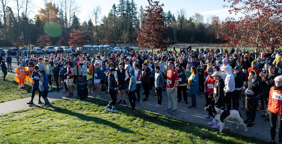 Hundreds of runners gather for the start of the race.