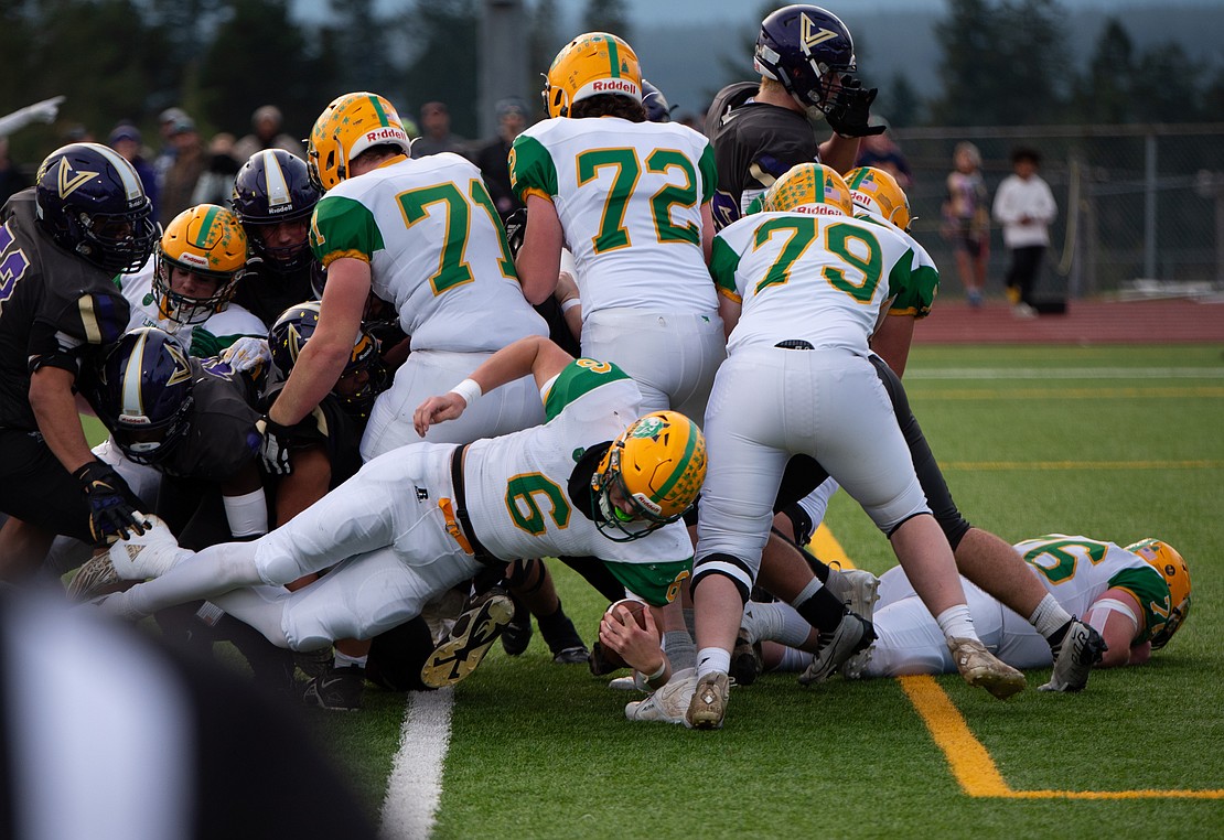 Lynden junior quarterback Brant Heppner falls into the end zone for the Lion's second score of the game.