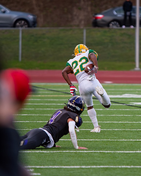 Lynden sophomore wide receiver Dani Bowler secures the ball behind his back on the way to the end zone.