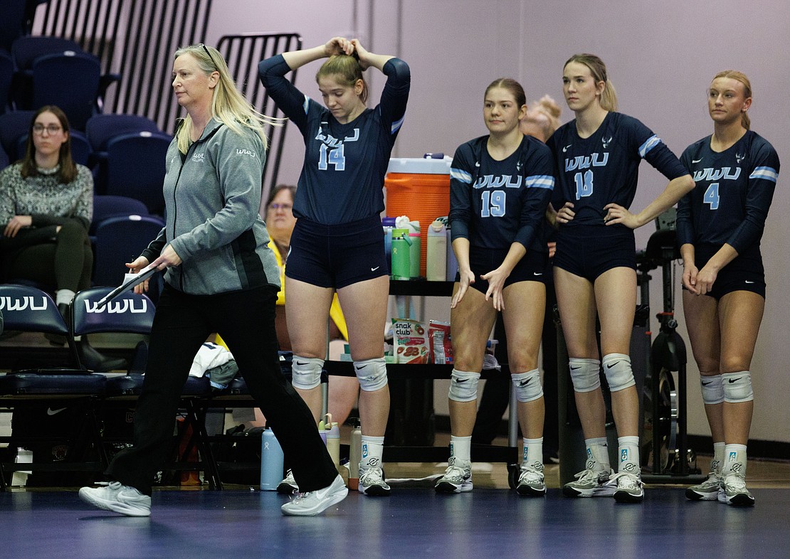 Western head coach Diane Flick-Wiliams reacts with her team after losing the second set.