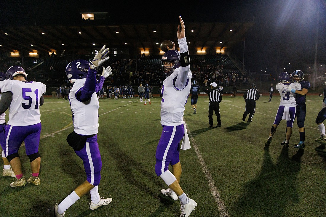 Nooksack Valley’s Joey Brown, right, and Kasey Newton celebrate the Pioneers’ 47-14 win over Lynden Christian on Friday, Nov. 17 in the 1A state quarterfinals. The victory sent Nooksack Valley to the semifinals for the second straight season where the Pioneers will face Lakeside of Nine Mile Falls.